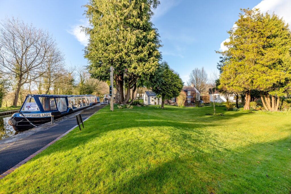 Canal, boats, and Lyneal Wharf cottages in Shropshire