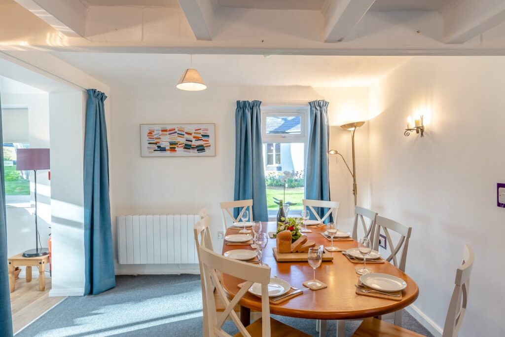 Dining table in a bright cottage room
